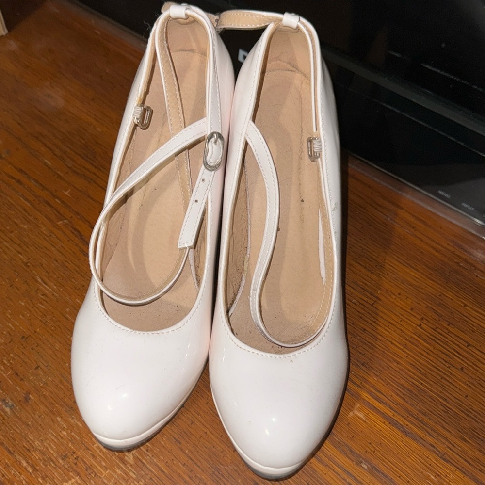 White heels with red bottoms